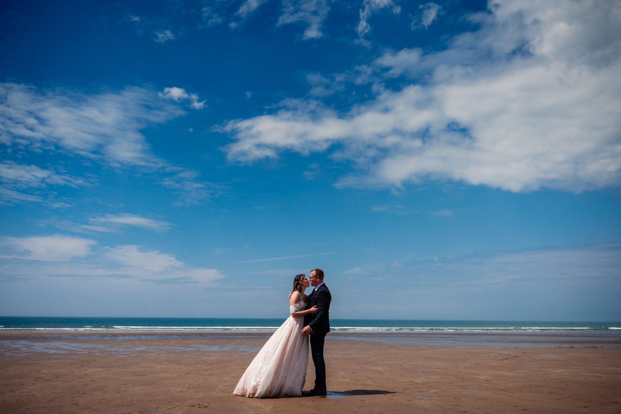 Wedding couple on sandy beach