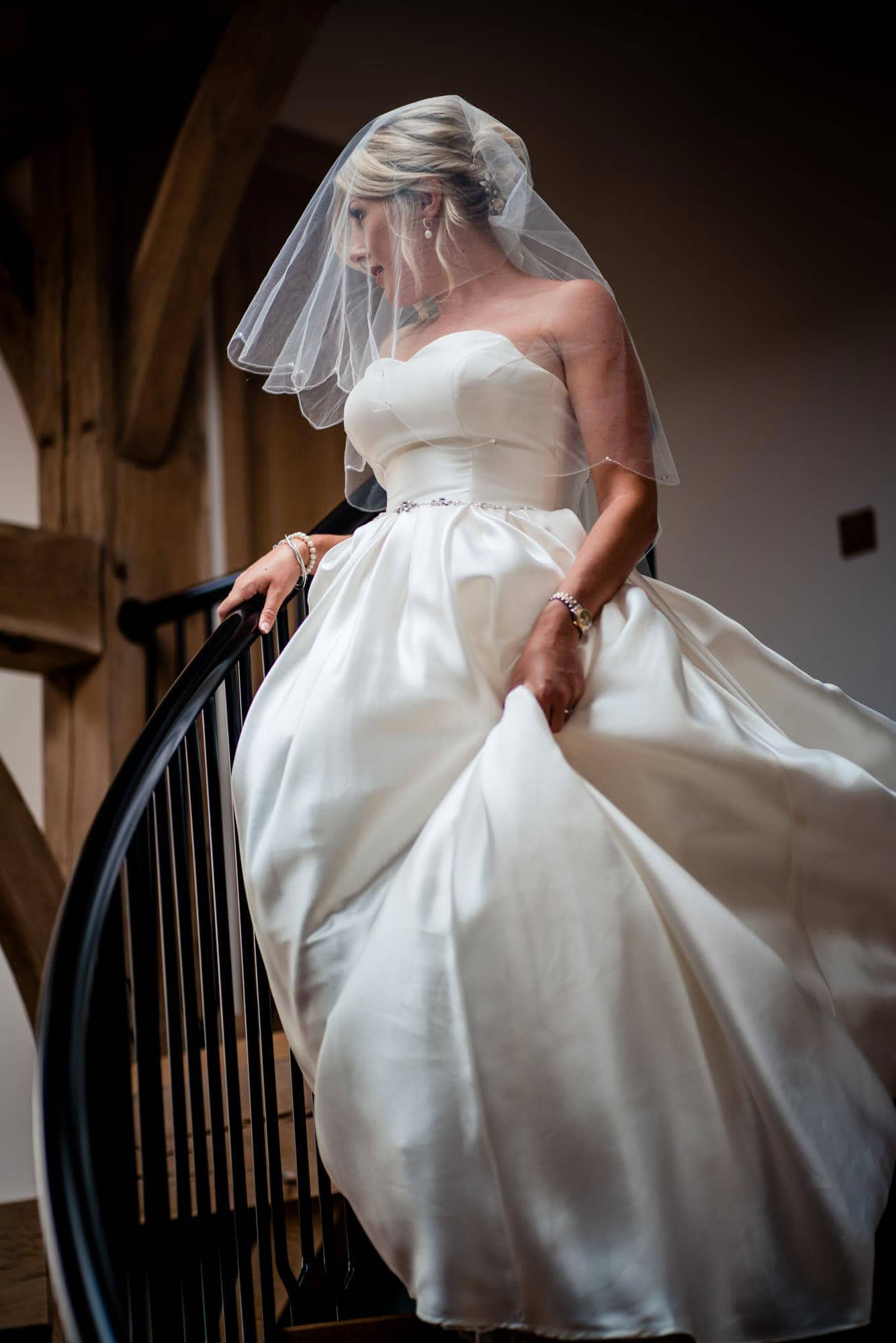 bride on spiral staircase Somerset wedding photographer