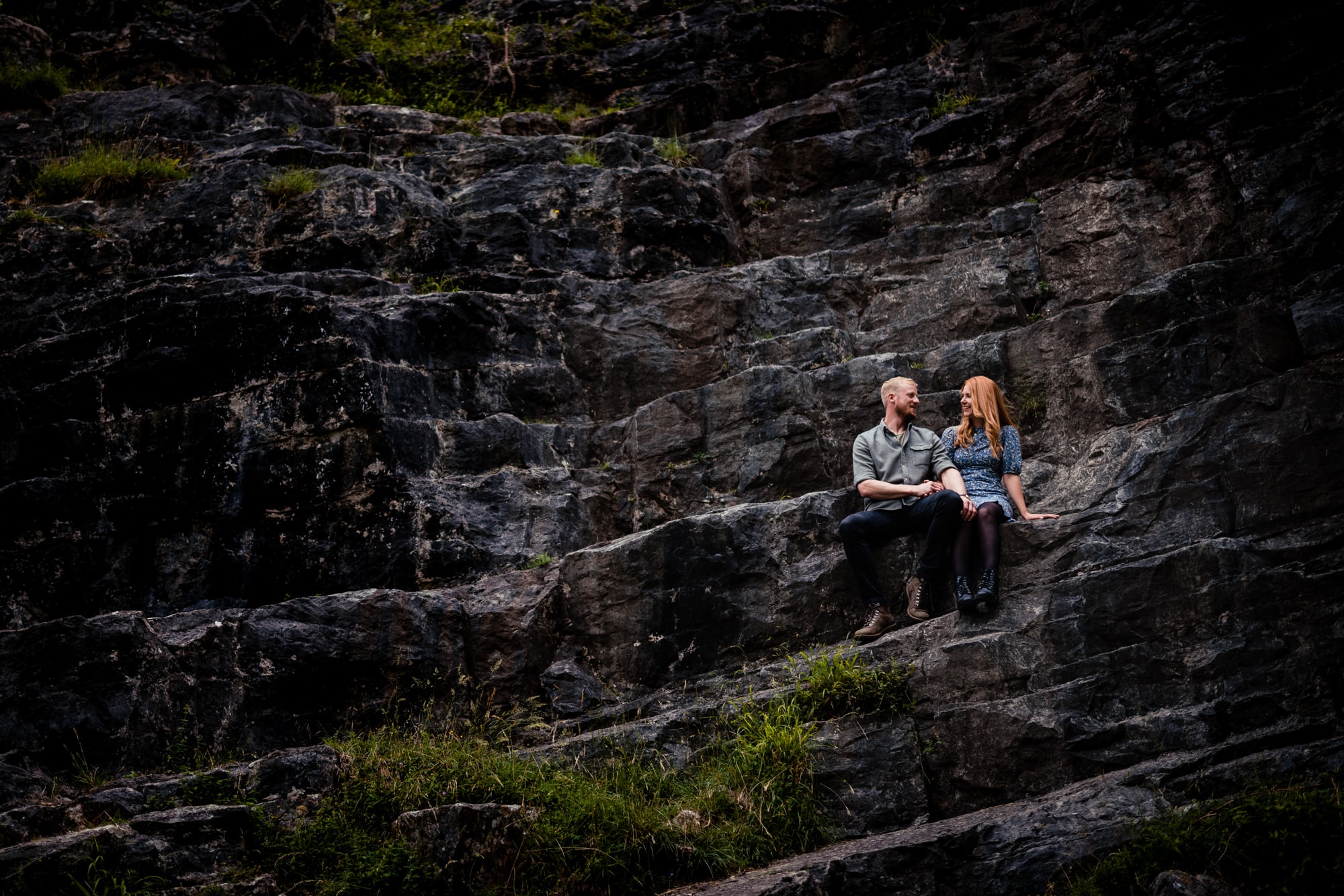 Devon enngagement photography couple sitting in cheddar gorge