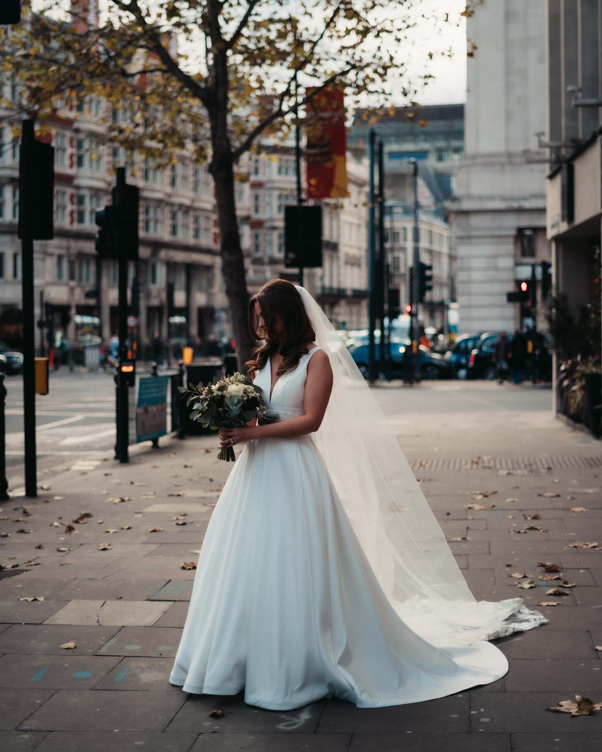 bride in fairy tale dress in London street