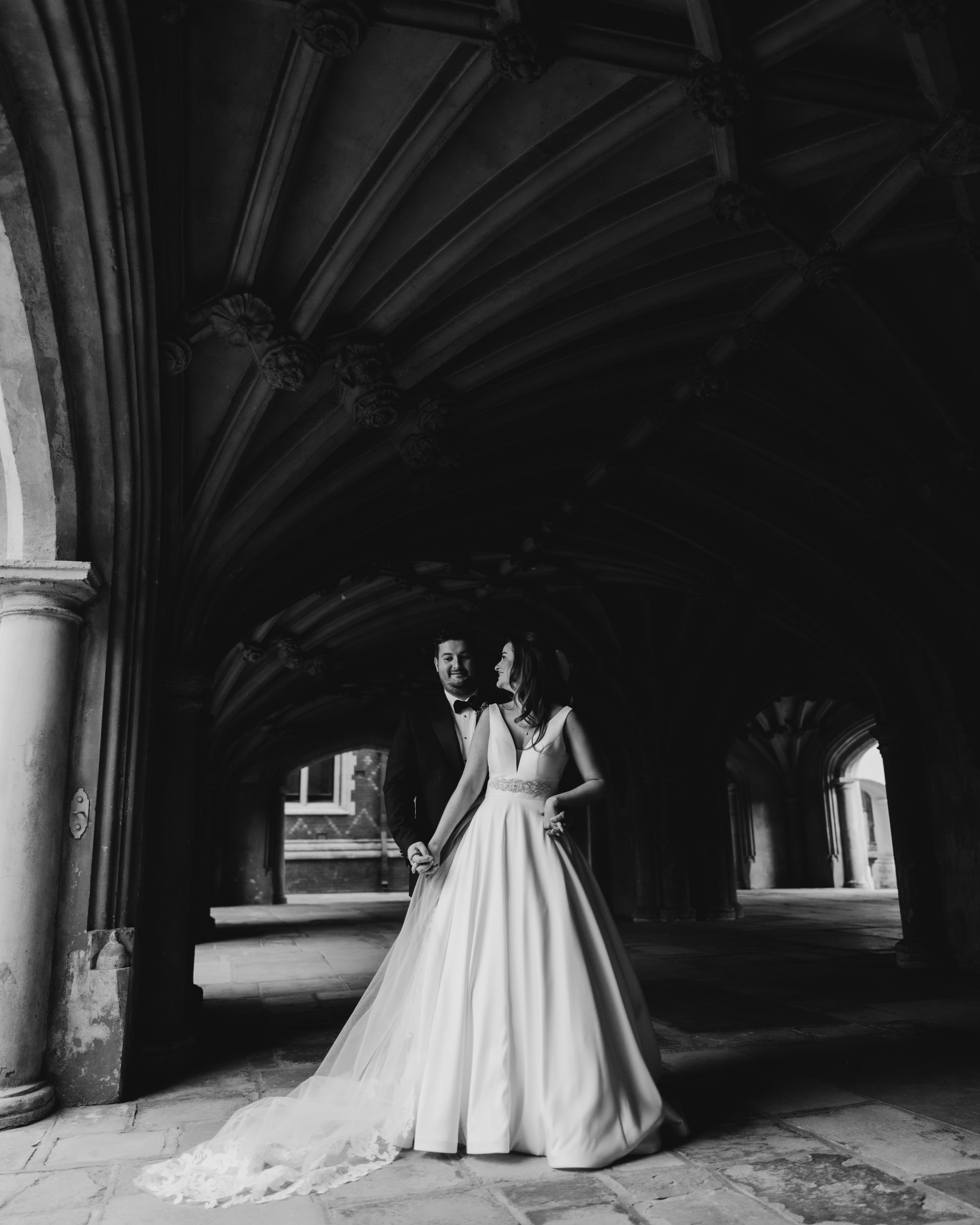 bride and groom stood in arch at Lincoln's Inn